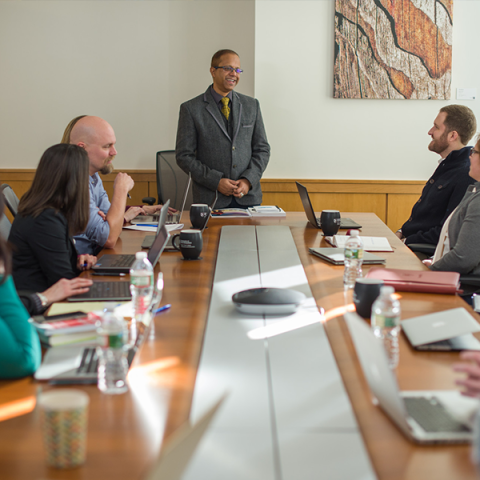 An instructor at UNH leading a change management course.